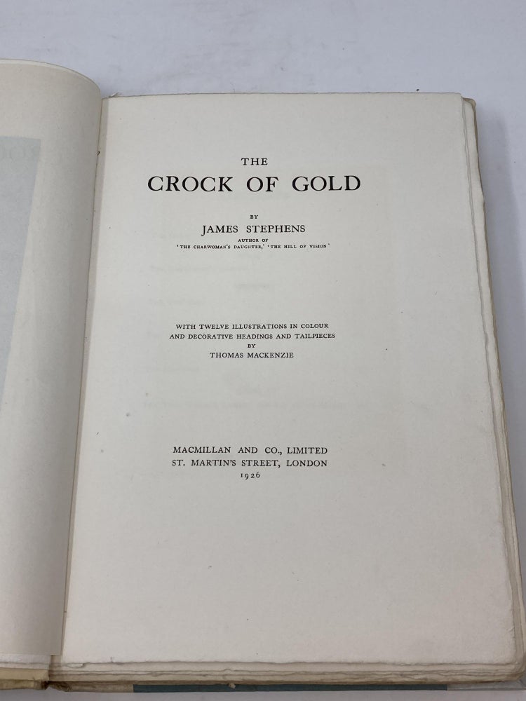 Item #85909 THE CROCK OF GOLD (SIGNED); WITH TWELVE ILLUSTRATIONS IN COLOUR AND DECORATIVE HEADINGS AND TAILPIECES BY THOMAS MACKENZIE (SIGNED). James Stephens.