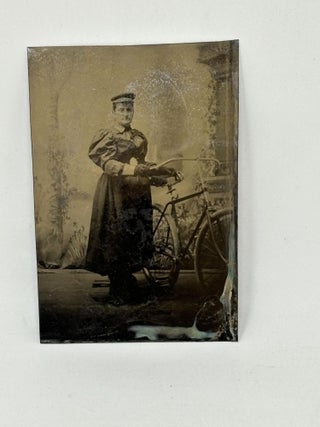 Item #86965 GROUP OF THREE TINTYPE PHOTOGRAPHS OF WOMEN POSING ON OR BESIDE THEIR BICYCLES ...